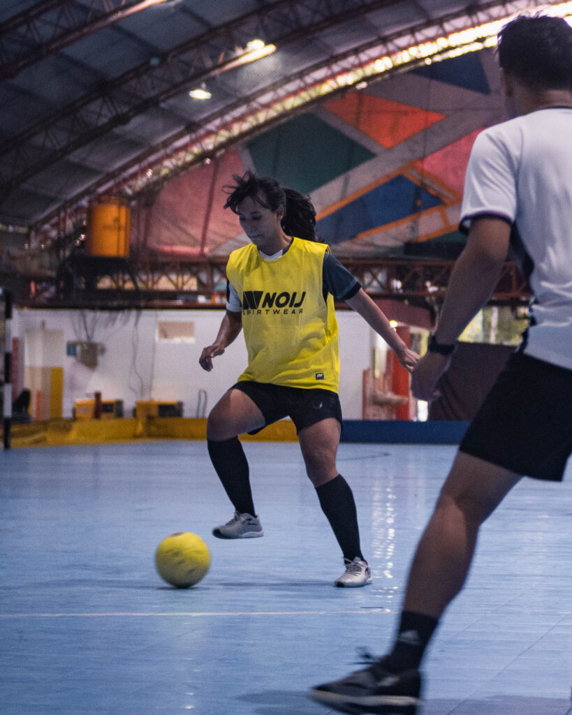 Futsal player on an indoor court for live futsal betting odds