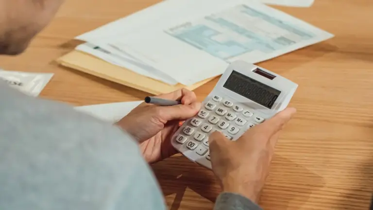 Calculator and financial documents for casino account checks