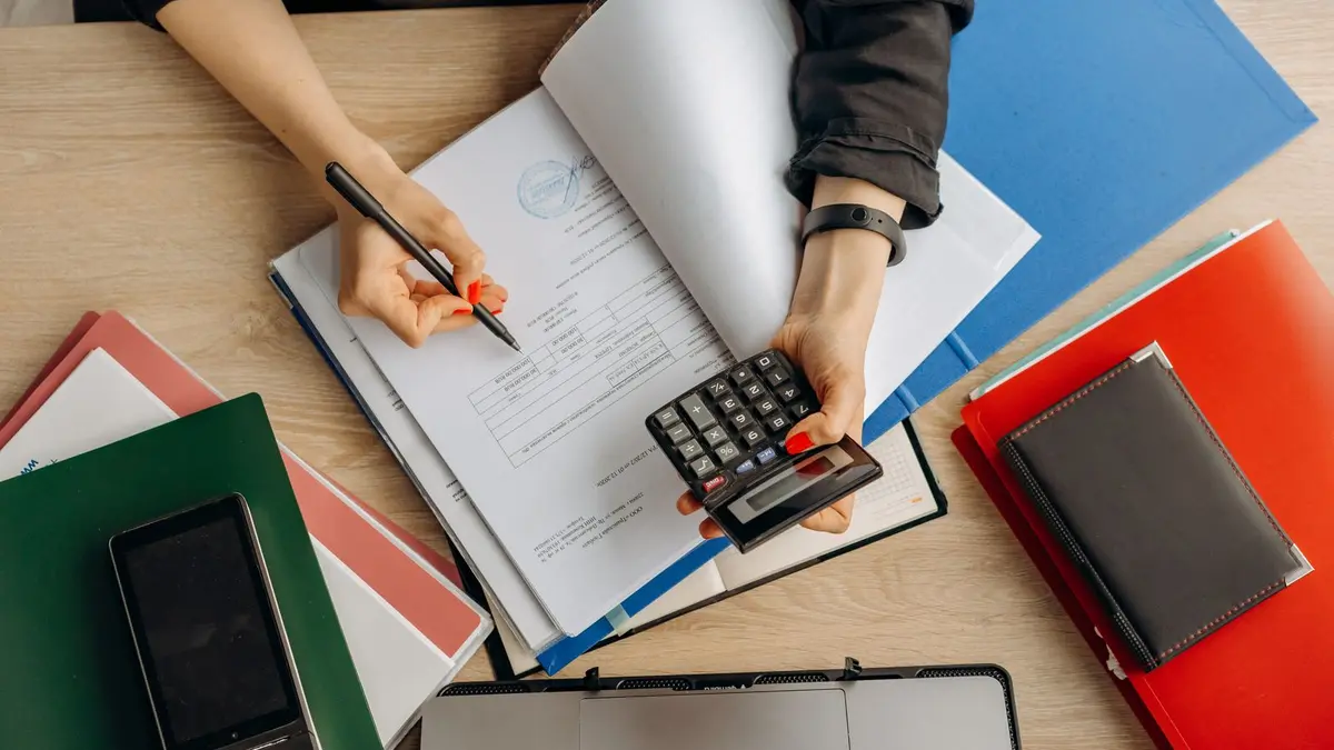 Person examining documents during a financial review