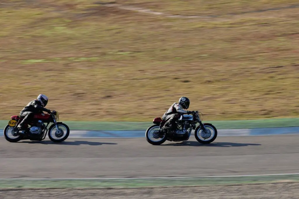 Motorcycle racers riding together on a circuit