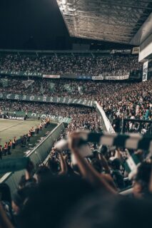 Football crowd in a packed stadium at night, illustrating Carabao Cup betting